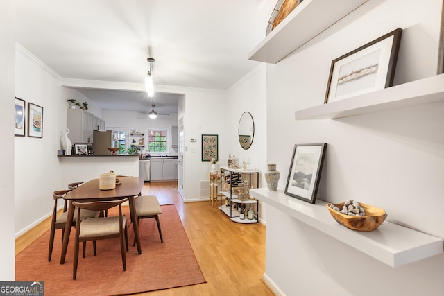 3675 Peachtree Rd NE Apt 24, Atlanta, GA 30319 - dining room featuring light wood-style floors, crown molding, and ceiling fan