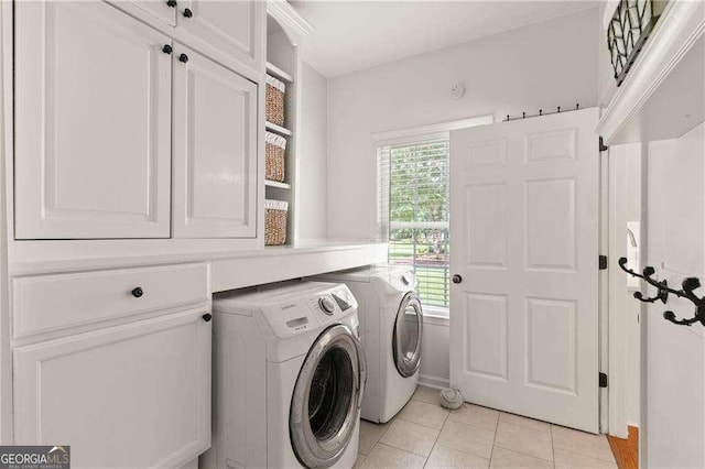162 Drakes Lndg, Brunswick, GA 31523 - laundry room with cabinet space, light tile patterned flooring, and washing machine and clothes dryer