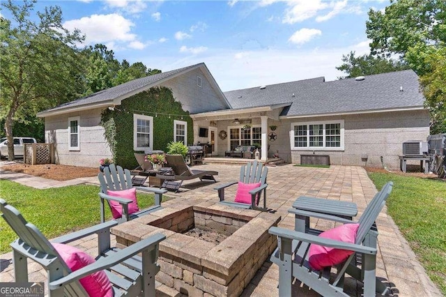 162 Drakes Lndg, Brunswick, GA 31523 - rear view of property featuring an outdoor fire pit, a patio area, a yard, a ceiling fan, and a shingled roof