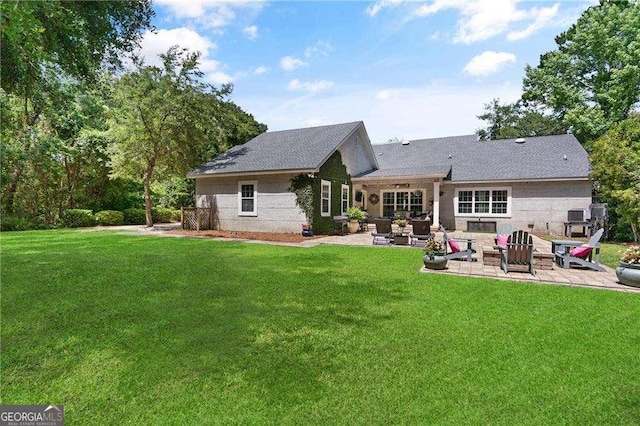 162 Drakes Lndg, Brunswick, GA 31523 - back of property with a patio area, a yard, and outdoor lounge area