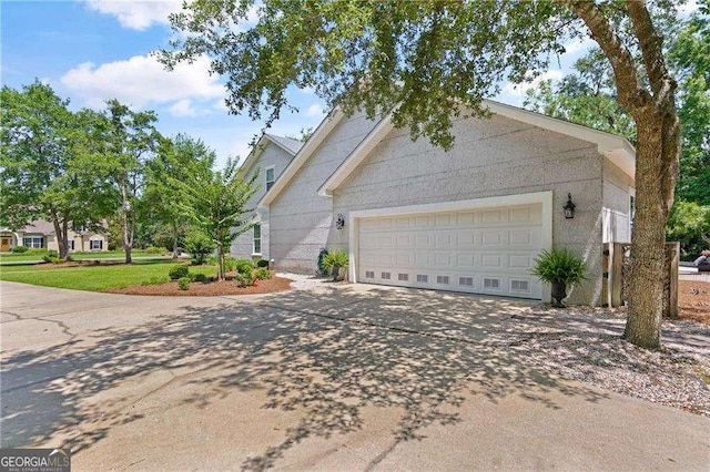 162 Drakes Lndg, Brunswick, GA 31523 - view of home's exterior with concrete driveway and a garage