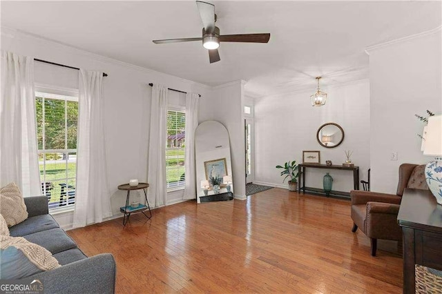 162 Drakes Lndg, Brunswick, GA 31523 - living room featuring wood finished floors, ceiling fan, and ornamental molding