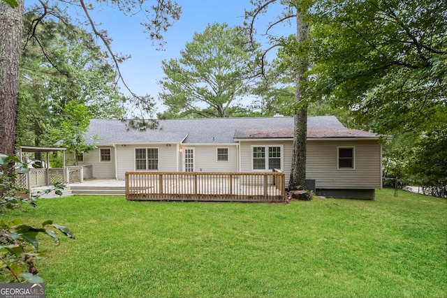 2090 Blackberry Ln, Auburn, GA 30011 - back of property featuring a lawn, a wooden deck, and roof with shingles