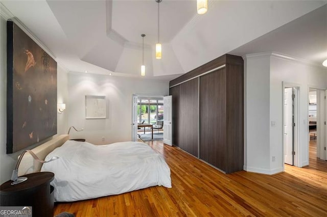 4569 Fountain Dr, Marietta, GA 30067 - bedroom with a tray ceiling, wood finished floors, and ornamental molding