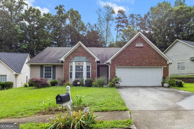 580 Lilburn School Rd, Lilburn, GA 30047 - view of front facade with concrete driveway, an attached garage, a front lawn, and brick siding