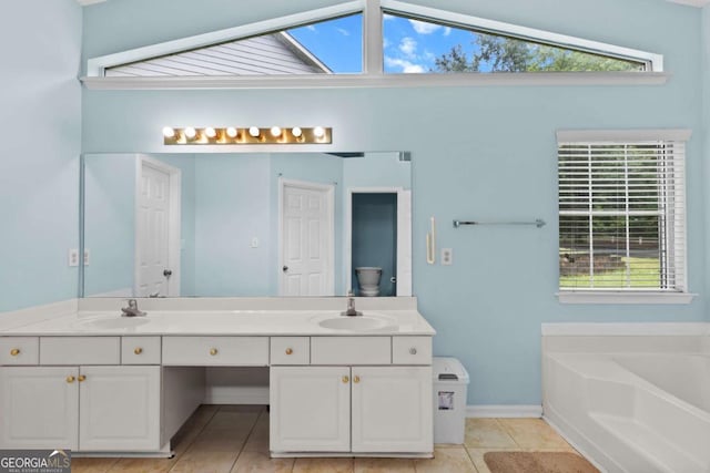 580 Lilburn School Rd, Lilburn, GA 30047 - bathroom with double vanity, tile patterned flooring, a bath, and plenty of natural light