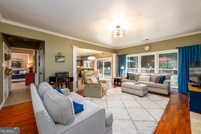 1767 Tidewell Trce, Lawrenceville, GA 30043 - living area featuring crown molding, wood finished floors, and decorative columns