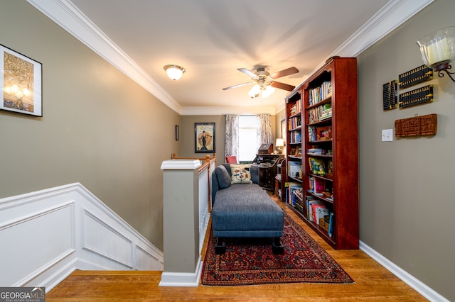 1767 Tidewell Trce, Lawrenceville, GA 30043 - sitting room featuring ornamental molding, an upstairs landing, wood finished floors, and ceiling fan