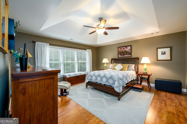 1767 Tidewell Trce, Lawrenceville, GA 30043 - bedroom featuring a raised ceiling, wood-type flooring, and ceiling fan