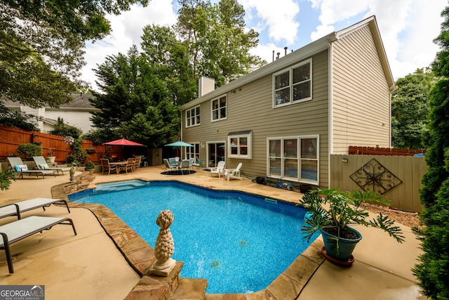 1767 Tidewell Trce, Lawrenceville, GA 30043 - view of swimming pool with a patio, a fenced backyard, and outdoor dining space
