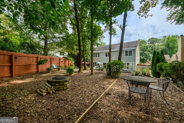 1767 Tidewell Trce, Lawrenceville, GA 30043 - view of yard featuring a fire pit