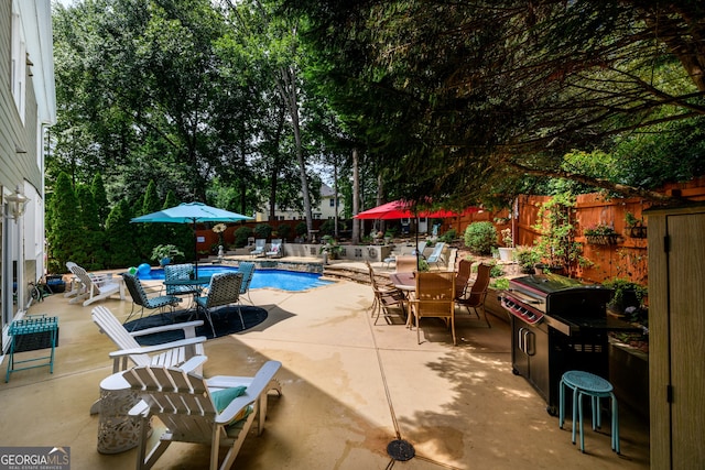 1767 Tidewell Trce, Lawrenceville, GA 30043 - view of swimming pool featuring a patio, outdoor dining area, and a fenced backyard