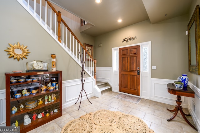 1767 Tidewell Trce, Lawrenceville, GA 30043 - tiled entryway with stairway, a decorative wall, wainscoting, and recessed lighting