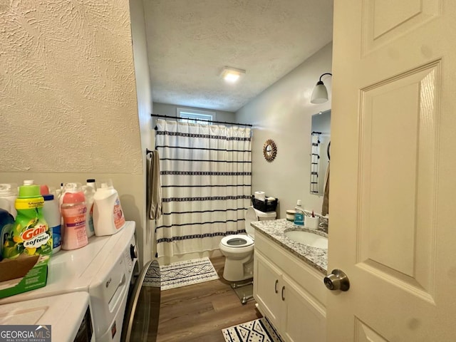 317 Running Deer Rd, Cleveland, GA 30528 - full bathroom with wood finished floors, vanity, a textured ceiling, and curtained shower