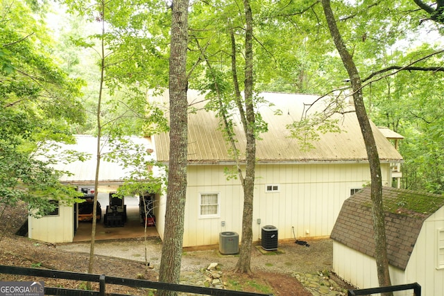 317 Running Deer Rd, Cleveland, GA 30528 - view of property exterior featuring a storage shed, a metal roof, and a patio