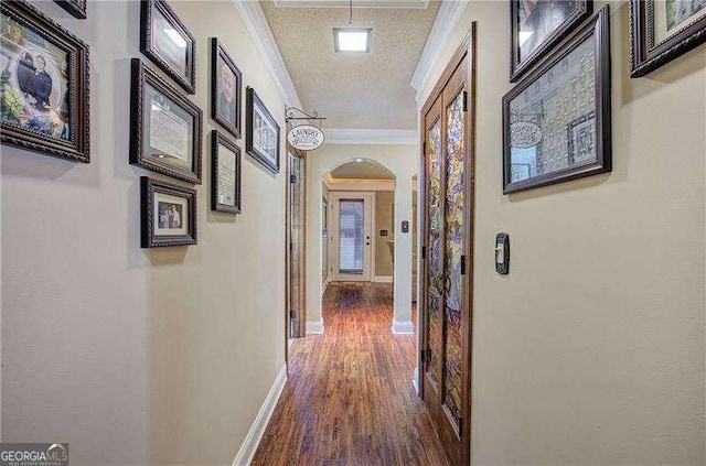 186 Wolverine Dr, Waleska, GA 30183 - hall with arched walkways, ornamental molding, and dark wood-style flooring