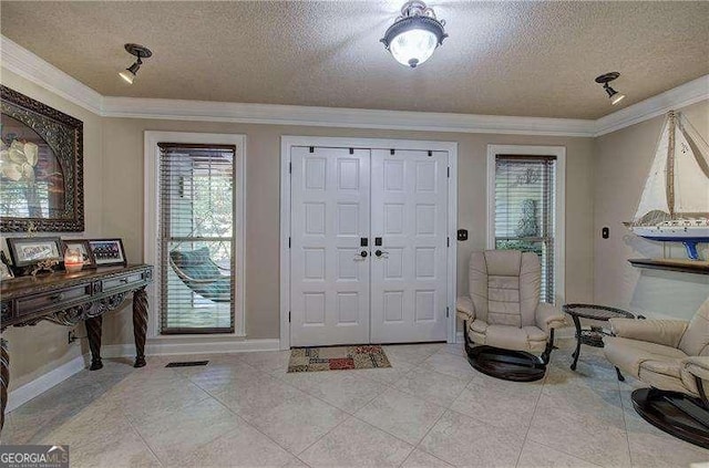 186 Wolverine Dr, Waleska, GA 30183 - foyer entrance featuring a textured ceiling, crown molding, and light tile patterned flooring