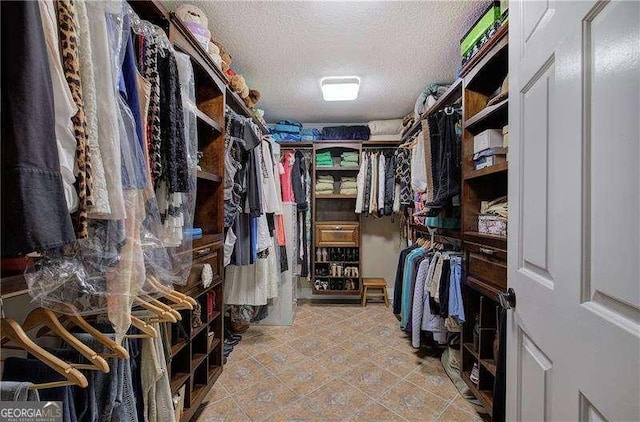 186 Wolverine Dr, Waleska, GA 30183 - spacious closet featuring tile patterned floors