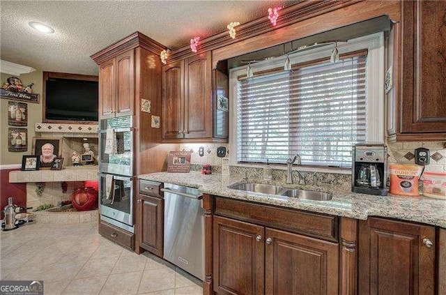 186 Wolverine Dr, Waleska, GA 30183 - kitchen featuring stainless steel appliances, a textured ceiling, light tile patterned flooring, tasteful backsplash, and light stone counters