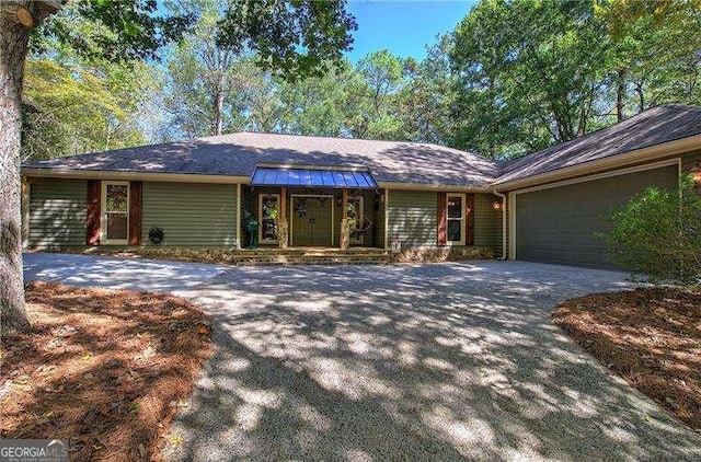 186 Wolverine Dr, Waleska, GA 30183 - single story home featuring driveway, a porch, and a garage