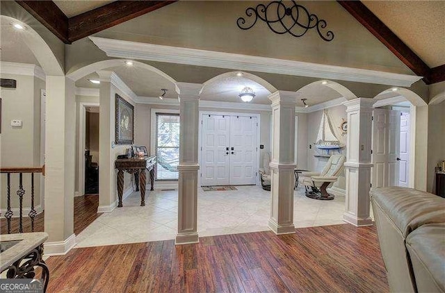 186 Wolverine Dr, Waleska, GA 30183 - foyer entrance with decorative columns, light wood finished floors, and ornamental molding