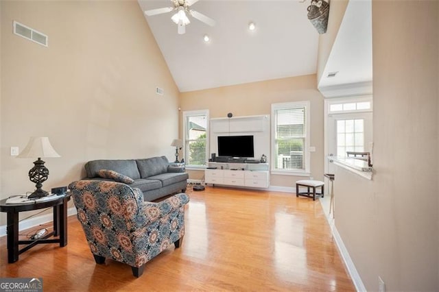 1979 Spivey Vlg, Jonesboro, GA 30236 - living area with high vaulted ceiling, ceiling fan, and light wood-type flooring