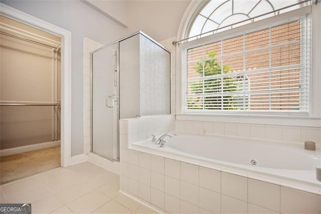 1979 Spivey Vlg, Jonesboro, GA 30236 - bathroom featuring a stall shower, a garden tub, and tile patterned floors