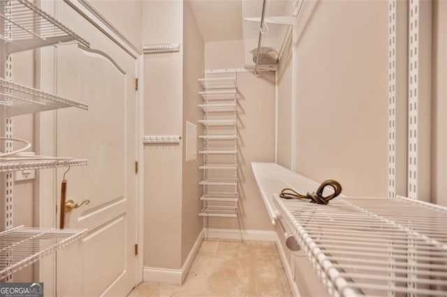 1979 Spivey Vlg, Jonesboro, GA 30236 - walk in closet with light tile patterned flooring