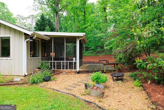 3402 Wynnewood Ln, Duluth, GA 30096 - view of yard with a sunroom and an outdoor fire pit