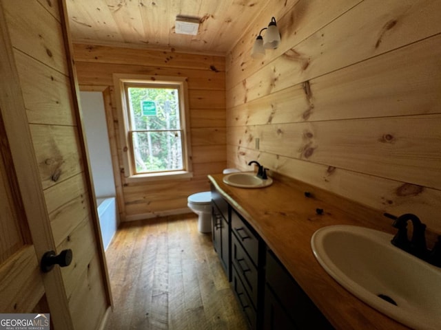 85 Christopher Dr Unit 108, Ellijay, GA 30540 - bathroom with wooden walls, wood ceiling, hardwood / wood-style floors, double vanity, and a bath