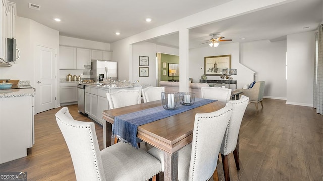 11893 Aukerman Way, Hampton, GA 30228 - dining room featuring a ceiling fan, wood finished floors, and recessed lighting