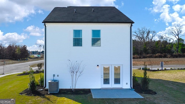 11893 Aukerman Way, Hampton, GA 30228 - back of property featuring a lawn and a patio area