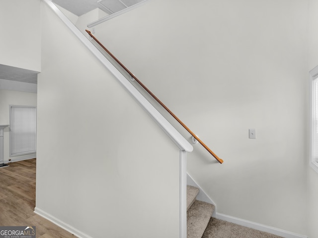 404 Northwind Pl, Stockbridge, GA 30281 - stairs with baseboards and wood finished floors