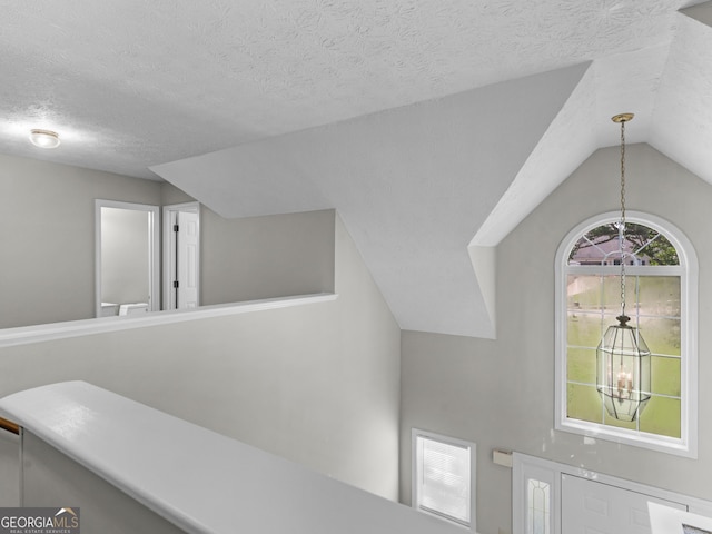 404 Northwind Pl, Stockbridge, GA 30281 - detailed view of a chandelier and a textured ceiling