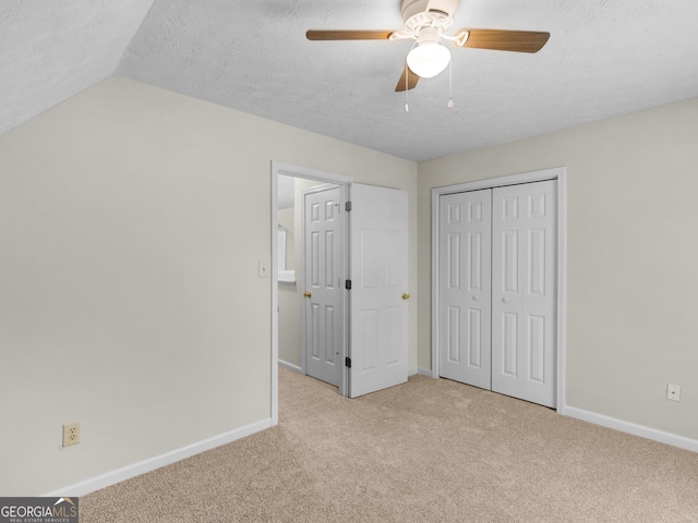 404 Northwind Pl, Stockbridge, GA 30281 - unfurnished bedroom featuring carpet flooring, a closet, ceiling fan, and a textured ceiling