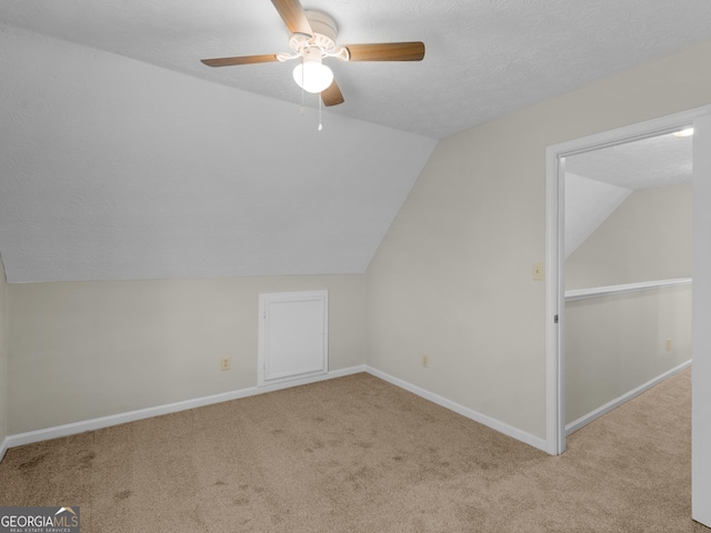404 Northwind Pl, Stockbridge, GA 30281 - additional living space with vaulted ceiling, carpet, and a ceiling fan