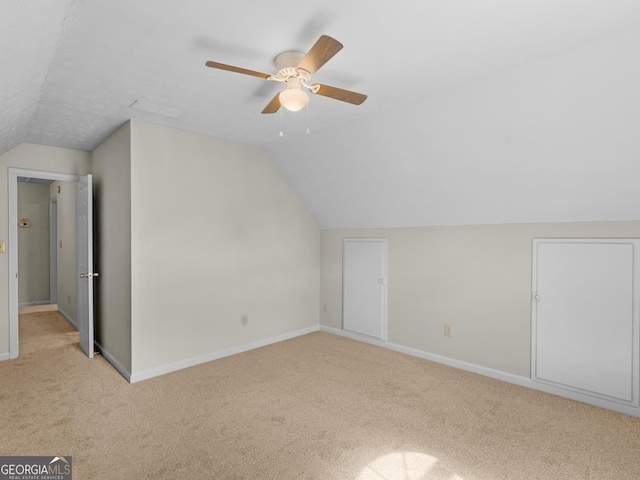 404 Northwind Pl, Stockbridge, GA 30281 - additional living space with carpet floors, lofted ceiling, and a ceiling fan