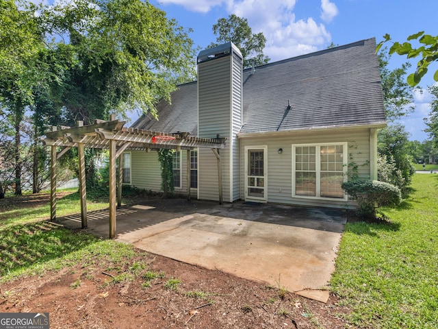 404 Northwind Pl, Stockbridge, GA 30281 - back of property with a pergola, a patio, a chimney, a yard, and roof with shingles