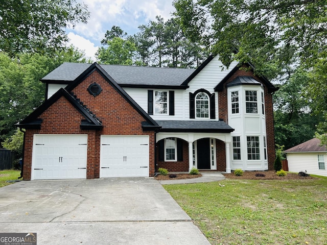 160 Magnolia Walk Ln, South Fulton, GA 30349 - traditional-style home with driveway, a porch, a front yard, and brick siding