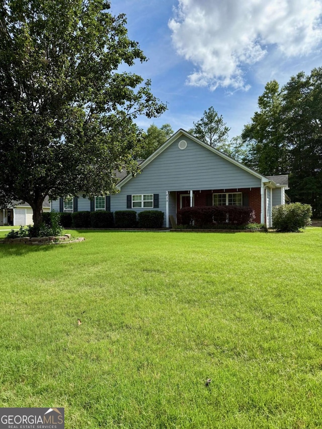1013 Navaho Trl, Monroe, GA 30655 - ranch-style house featuring a front lawn