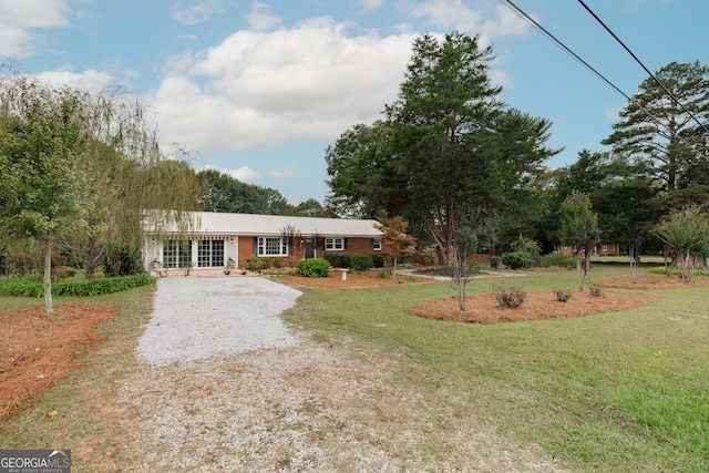 1471 Lenru Rd, Bogart, GA 30622 - single story home featuring gravel driveway, a front lawn, a metal roof, and brick siding