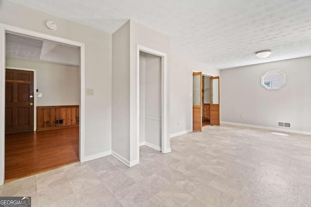 58 6th Ave W, Dallas, GA 30157 - unfurnished bedroom with a textured ceiling and baseboards
