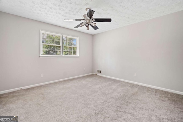 58 6th Ave W, Dallas, GA 30157 - unfurnished room featuring carpet, ceiling fan, and a textured ceiling