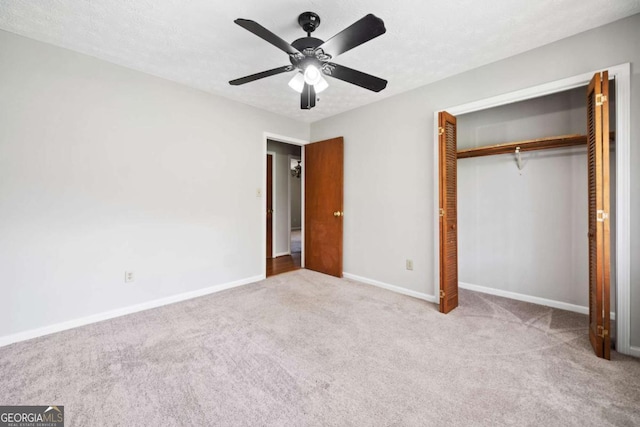 58 6th Ave W, Dallas, GA 30157 - unfurnished bedroom featuring carpet floors, a closet, and a ceiling fan