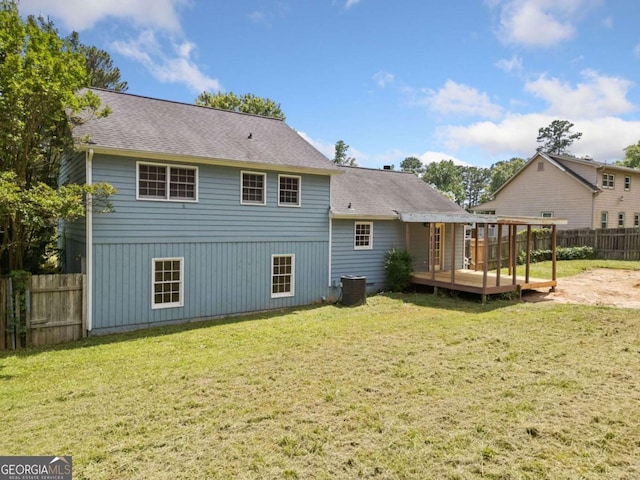 58 6th Ave W, Dallas, GA 30157 - rear view of property featuring a wooden deck, a fenced backyard, and roof with shingles