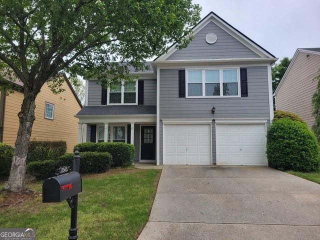 13565 Weycroft Cir, Alpharetta, GA 30004 - traditional-style home featuring an attached garage, concrete driveway, and a front lawn