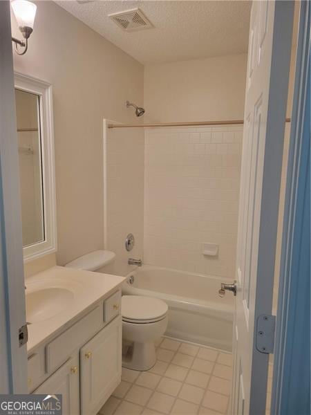 13565 Weycroft Cir, Alpharetta, GA 30004 - full bath featuring tile patterned floors, vanity, shower / tub combination, and a textured ceiling