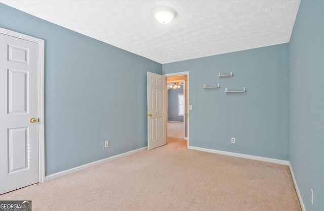 375 Shadetree Ln, Lawrenceville, GA 30044 - unfurnished bedroom with carpet and a textured ceiling