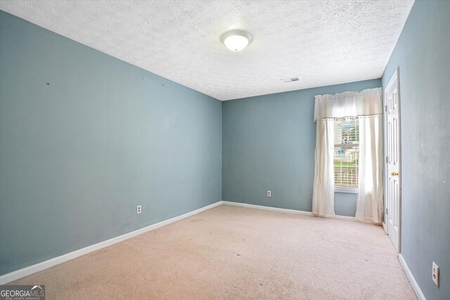 375 Shadetree Ln, Lawrenceville, GA 30044 - unfurnished room with carpet floors and a textured ceiling