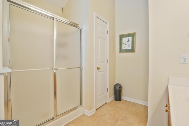375 Shadetree Ln, Lawrenceville, GA 30044 - bathroom featuring a shower with door and vanity